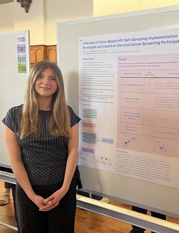 Reigan presenting her poster at the Spring Undergraduate Research Conference at Purdue